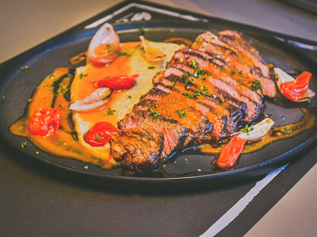 Grilled steak slices with roasted tomatoes and creamy orange sauce at Akiyo, a Japanese Restaurant in Johnson City