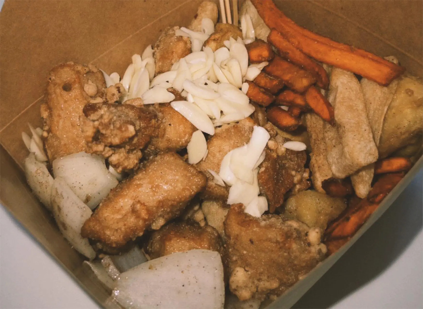 Salted crispy chicken box with sweet potato fries and almonds at All In 牡丹，a Chinese Taiwanese Restaurant in Rowland Heights
