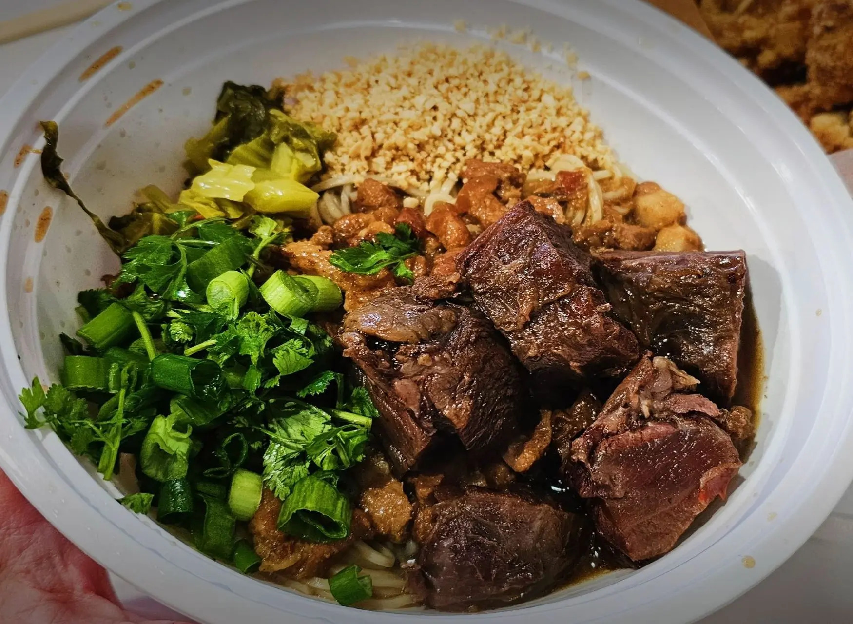 Beef noodle bowl with pickled vegetable and nuts at All In 牡丹，a Chinese Taiwanese Restaurant in Rowland Heights