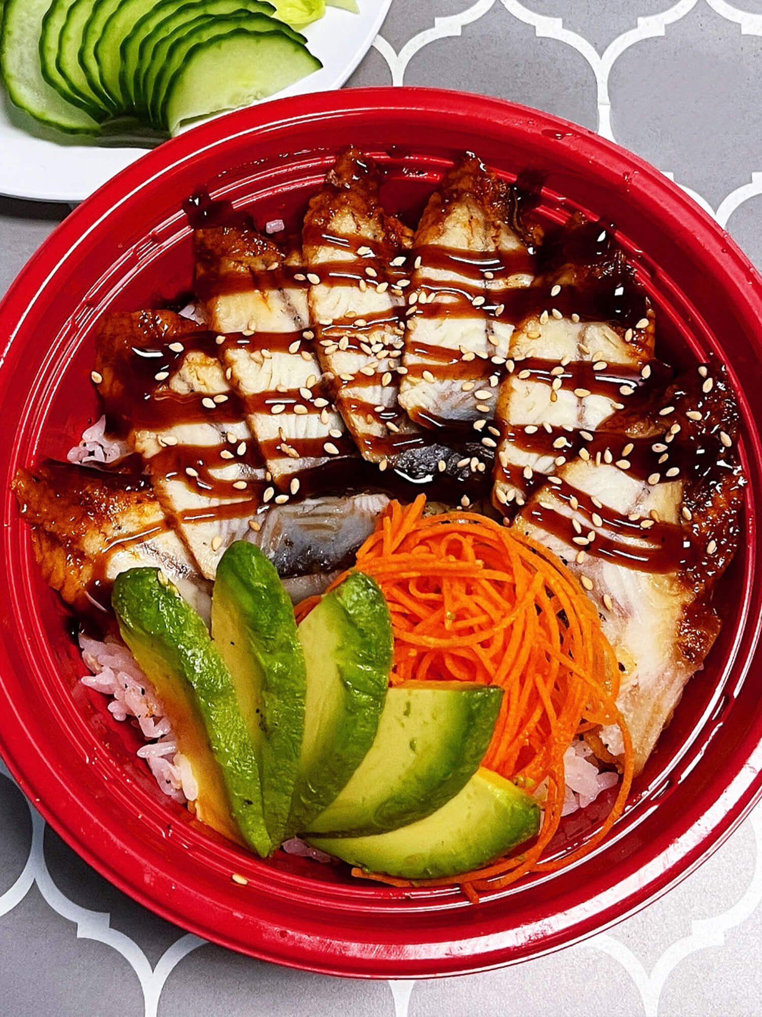 Grilled eel slices over rice, garnished with avocado Sushi burrito with chicken, avocado, and vegetables at Aloha Hawaiian BBQ & Sushi, a Asian Fusion restaurant in Baldwin Park