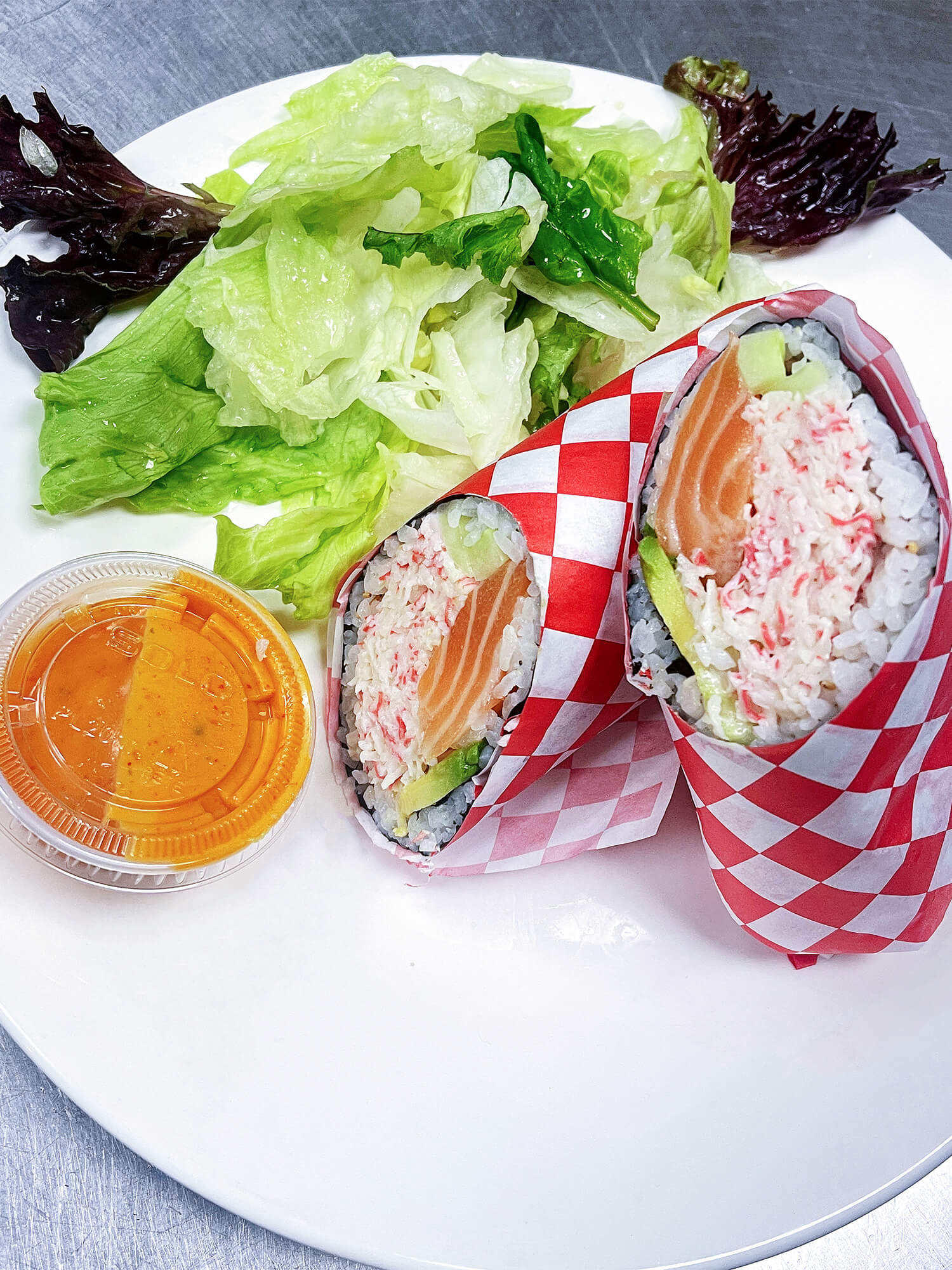 Sushi burrito filled with salmon, crab, avocado Sushi burrito with chicken, avocado, and vegetables at Aloha Hawaiian BBQ & Sushi, a Asian Fusion restaurant in Baldwin Park