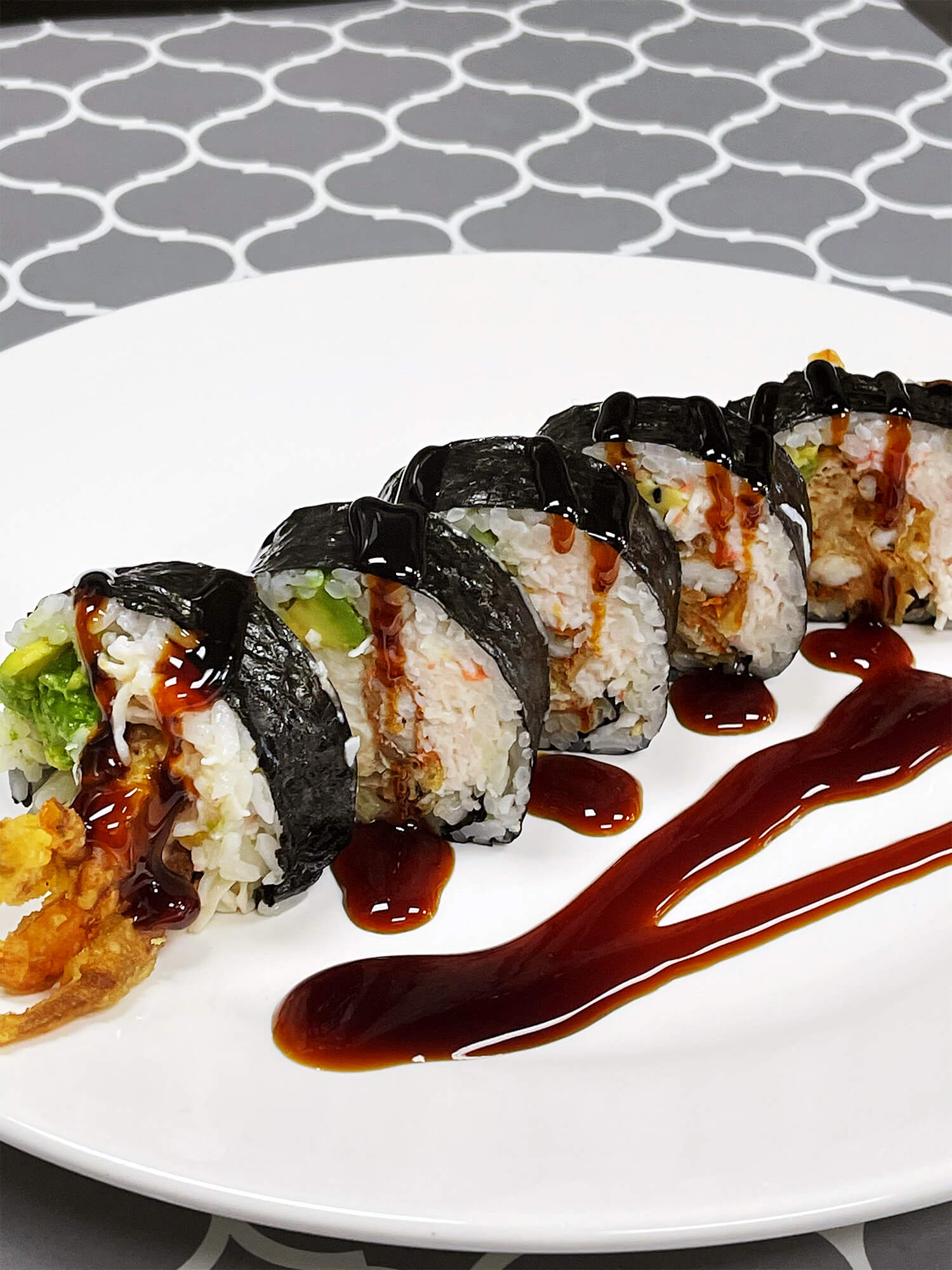 Sushi roll with tempura shrimp, avocado, and eel sauce drizzle at Aloha Hawaiian BBQ & Sushi, a Asian Fusion restaurant in Baldwin Park