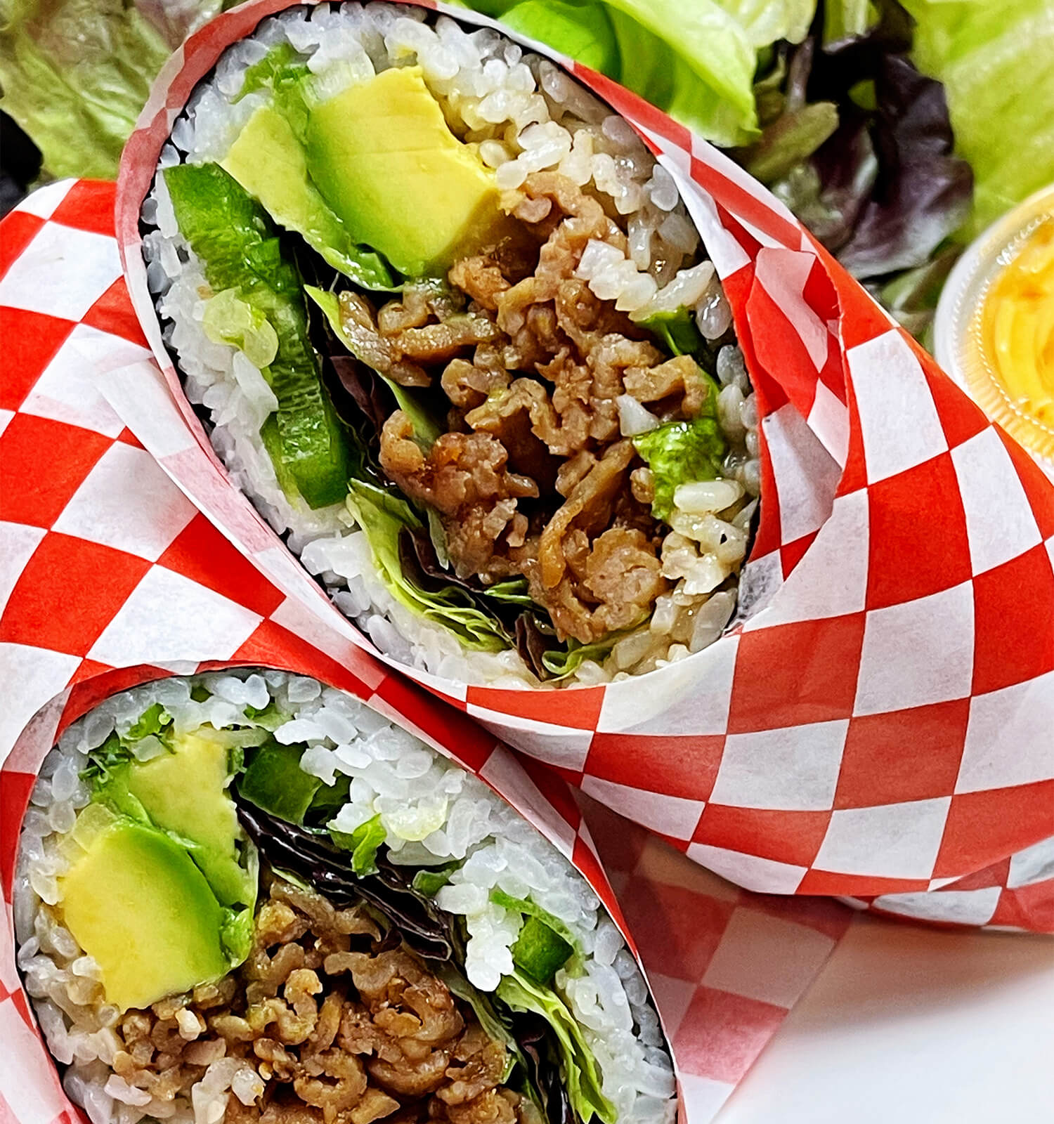 Sushi burrito with beef, avocado, and greens at Aloha Hawaiian BBQ & Sushi, a Asian Fusion restaurant in Baldwin Park