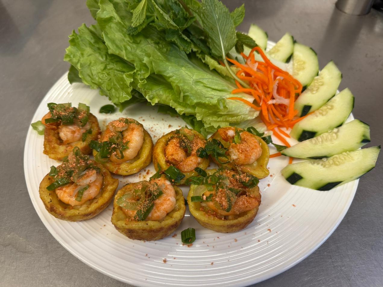 An-Chi-Vietnamese-restaurant-Mini-Pancake-San-Francisco Mini Pancake Small pancakes topped with shrimp, herbs, and veggies at An Chi, a Vietnamese restaurant in San Francisco