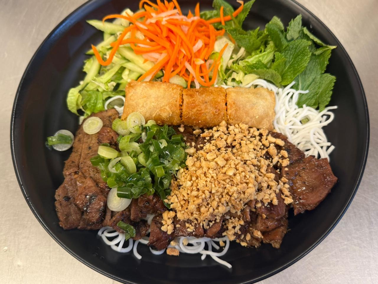 An-Chi-Vietnamese-restaurant-Pork-Imperial-Roll-w-Vermicelli-San-Francisco Pork Imperial Roll w Vermicelli Vermicelli bowl with pork rolls and veggies at An Chi, a Vietnamese restaurant in San Francisco