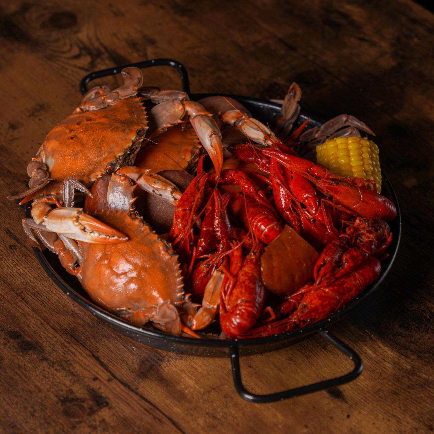Aquabite-Cajun-Seafood-Restaurant-Crab-And-Crawfish-Platter-Pasaden Platter with crab, crawfish and corn at Aquabite Cajun Seafood, a Seafood Restaurant in Pasaden