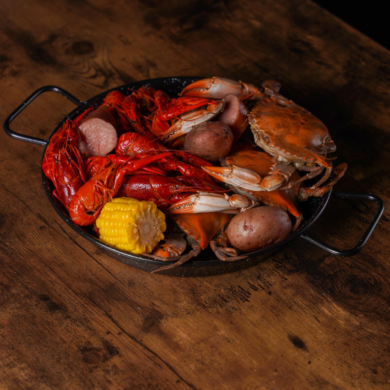 Aquabite-Cajun-Seafood-Restaurant-Crawfish-Crab-And-Sausage-Platter-Pasaden Platter with crawfish, crab, sausage and corn at Aquabite Cajun Seafood, a Seafood Restaurant in Pasaden