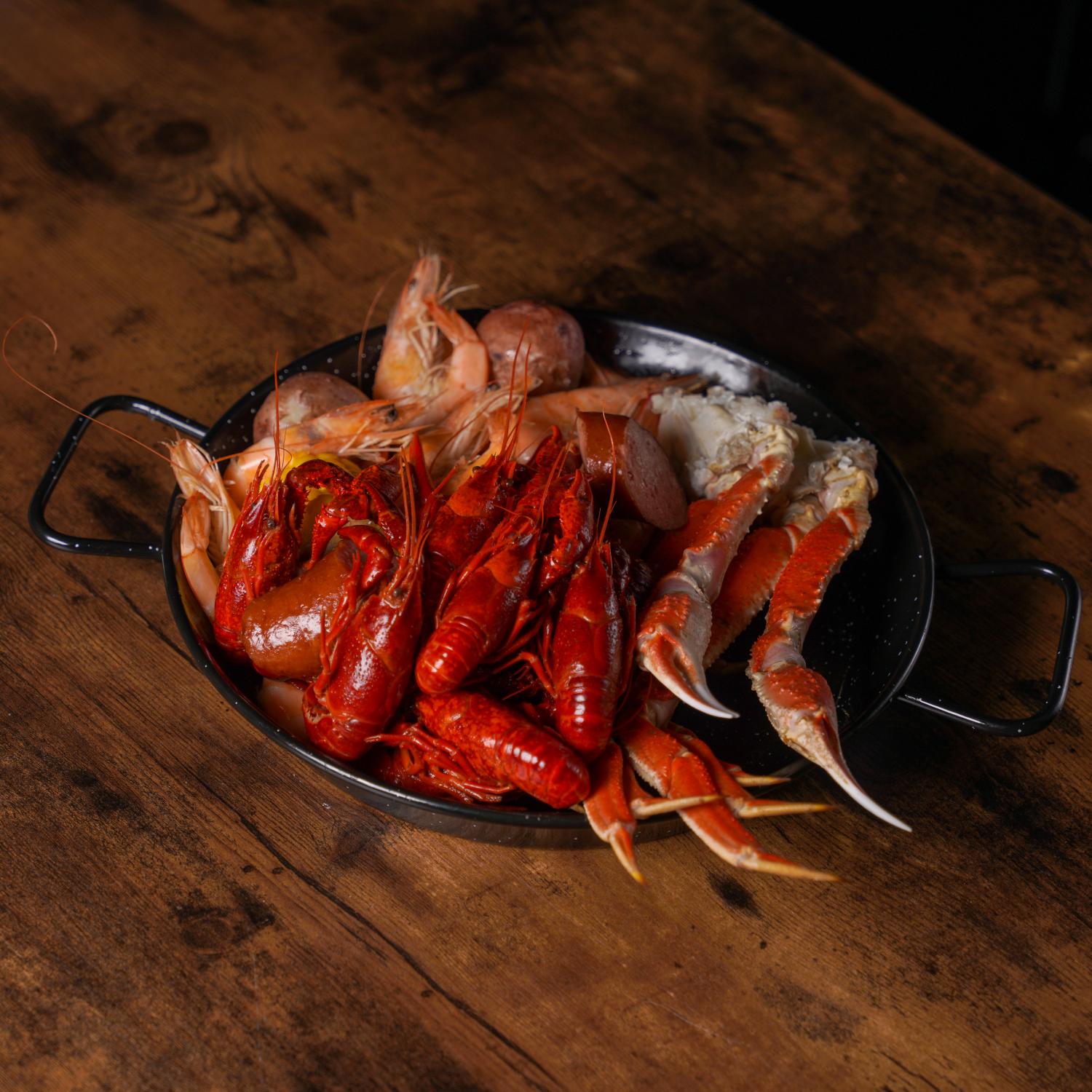 Aquabite-Cajun-Seafood-Restaurant-Lobster-Crab-And-Shrimp-Platter-Pasaden Platter with crawfish, shrimp and crab claws at Aquabite Cajun Seafood, a Seafood Restaurant in Pasaden