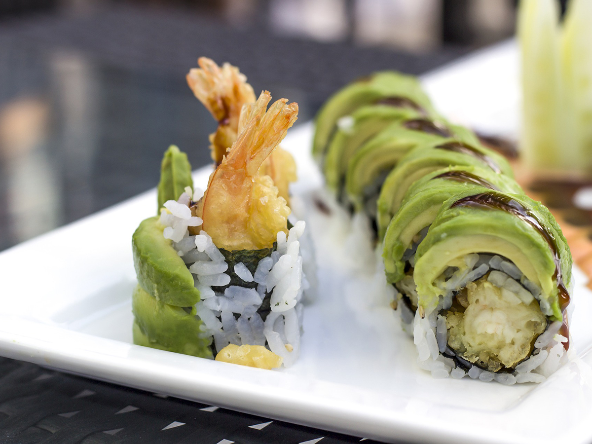 Tempura shrimp avocado sushi rolls on white plate at Arbor Sushi & Grill Express, a Japanese Restaurant in San Diego