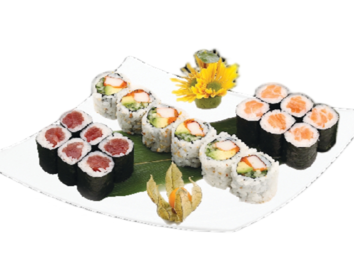 Sushi rolls with a small flower decoration on the plate.