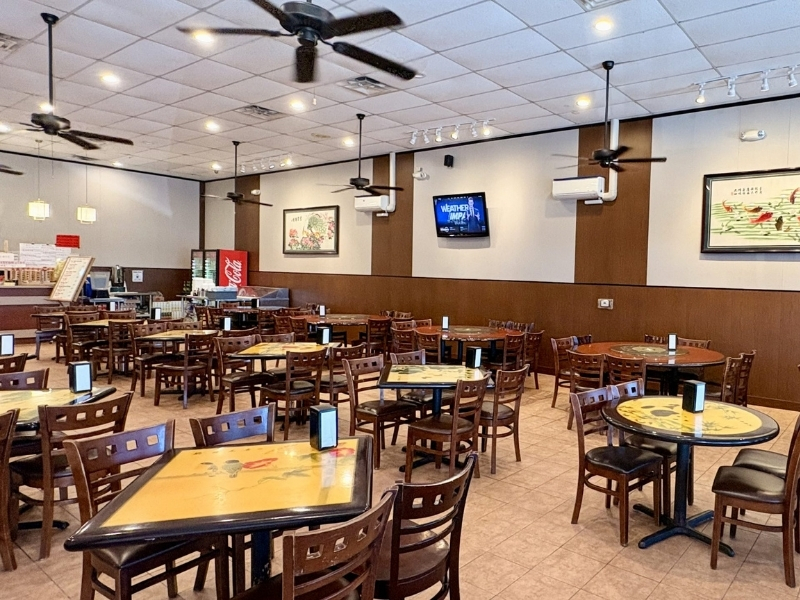 Spacious dining hall with tables & TVs at Asia Cafe, a Chinese Restaurant in Austin