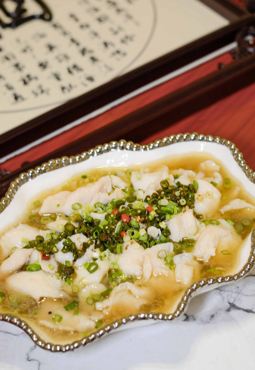 Steamed fish fillet with scallion oil at Asia Cafe, a Chinese Restaurant in Austin