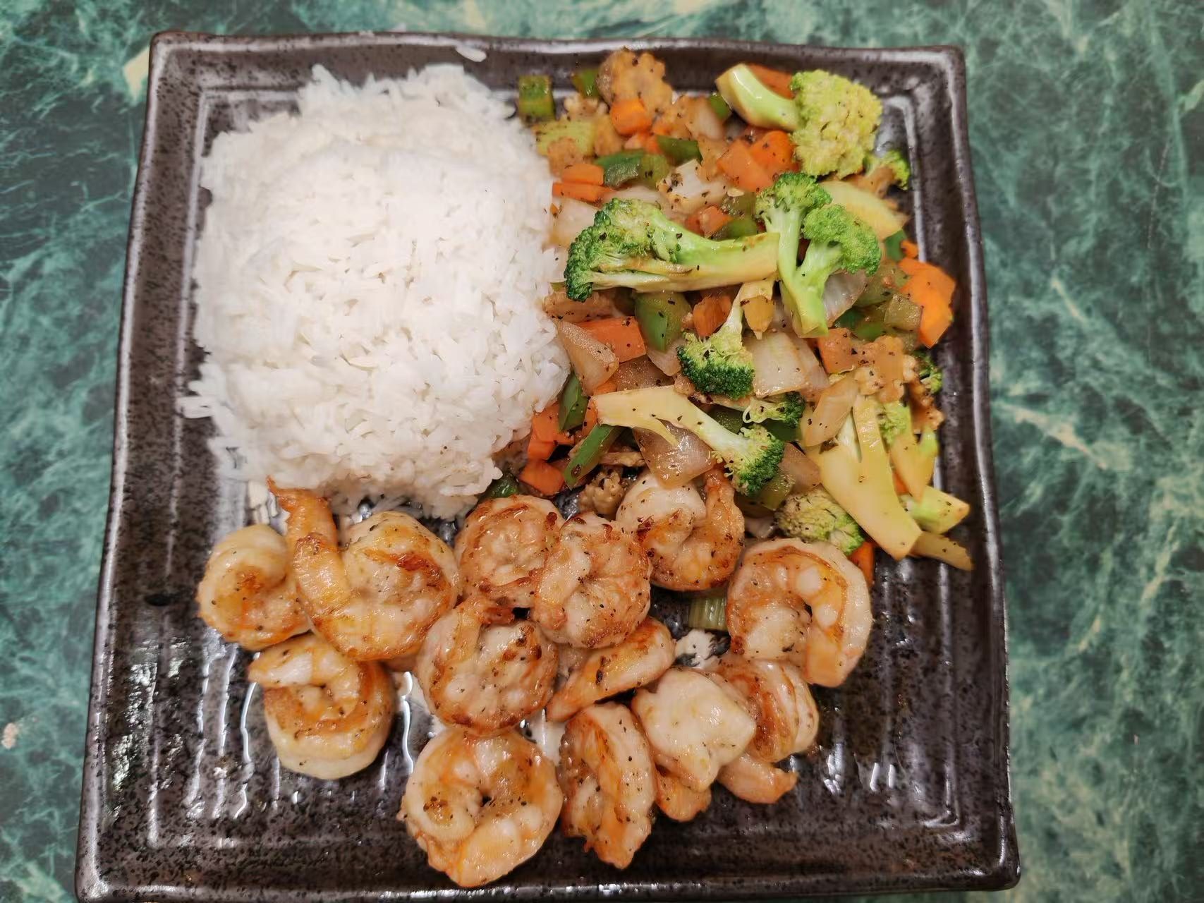 Grilled shrimp rice plate with broccoli, carrot and onion stir-fry at Asia Hibachi & Rice Bowls，an Asian Fusion Restaurant in Buffalo