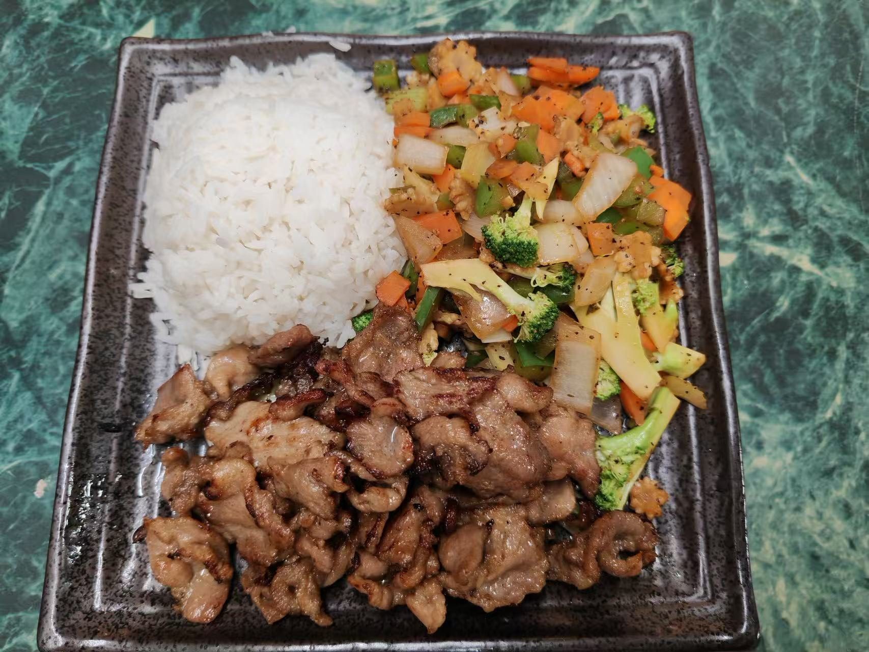 Grilled pork rice plate with mixed colorful stir-fried vegetables at Asia Hibachi & Rice Bowls，an Asian Fusion Restaurant in Buffalo