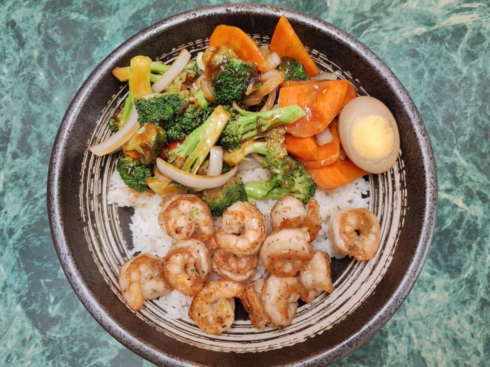 Shrimp rice bowl with broccoli, carrot, onion and marinated boiled egg at Asia Hibachi & Rice Bowls，an Asian Fusion Restaurant in Buffalo