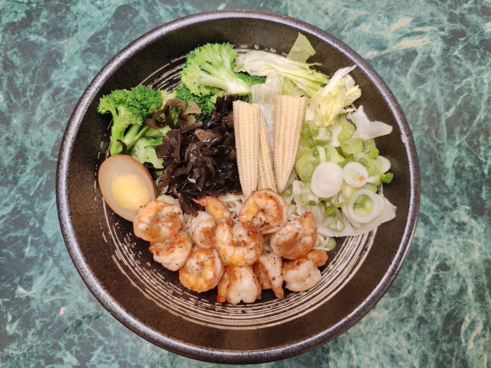 Shrimp noodle bowl loaded with various fresh vegetables and a marinated egg at Asia Hibachi & Rice Bowls，an Asian Fusion Restaurant in Buffalo