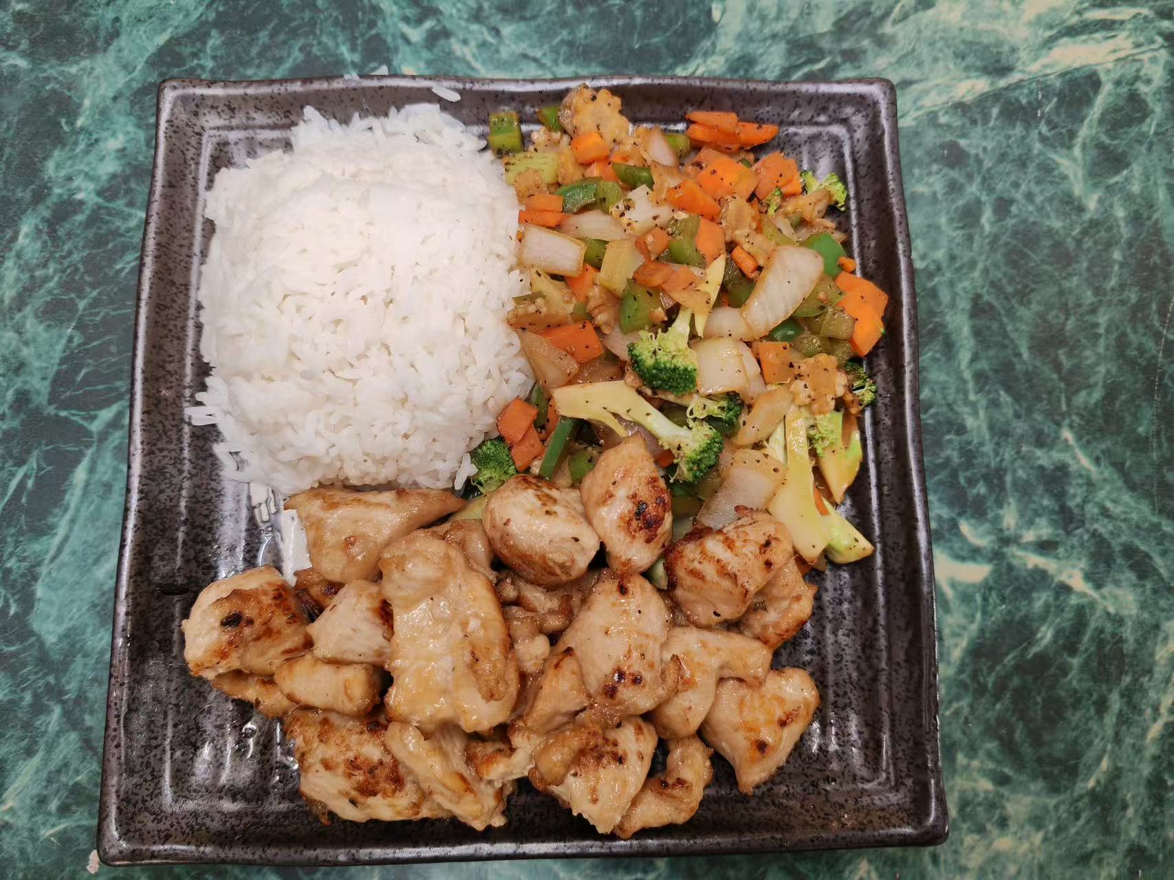 Grilled chicken rice plate with assorted diced fresh vegetables at Asia Hibachi & Rice Bowls，an Asian Fusion Restaurant in Buffalo