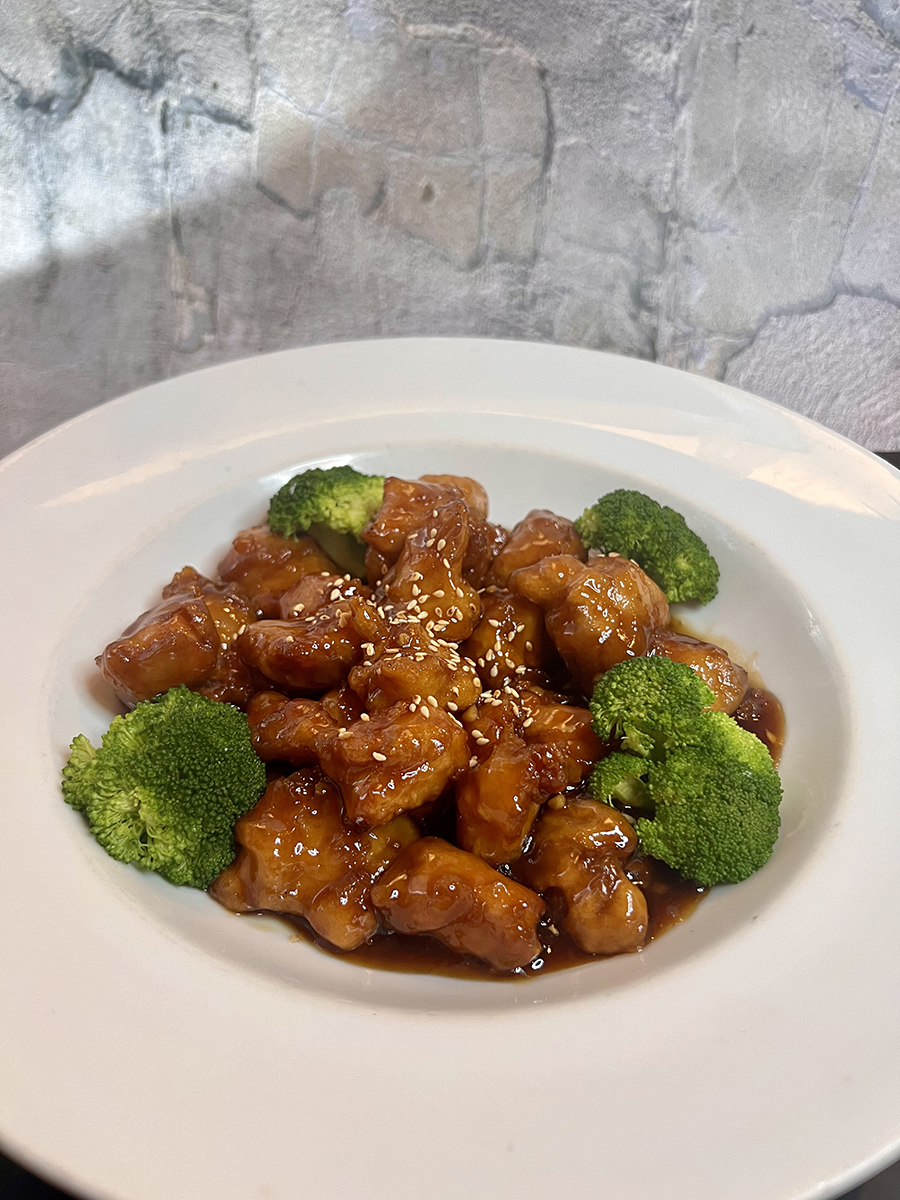Sesame chicken, fried chicken pieces with sesame in a plate at Asian Bites Pho & Fusion Kitchen, a Asian restaurant in Smyrna