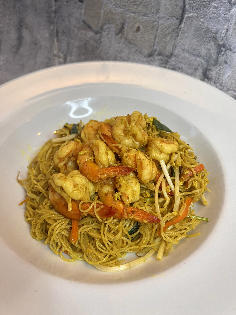 Singapore rice noodle with shrimp, yellow - souped rice noodles with veggies in a bowl at Asian Bites Pho & Fusion Kitchen, a Asian restaurant in Smyrna