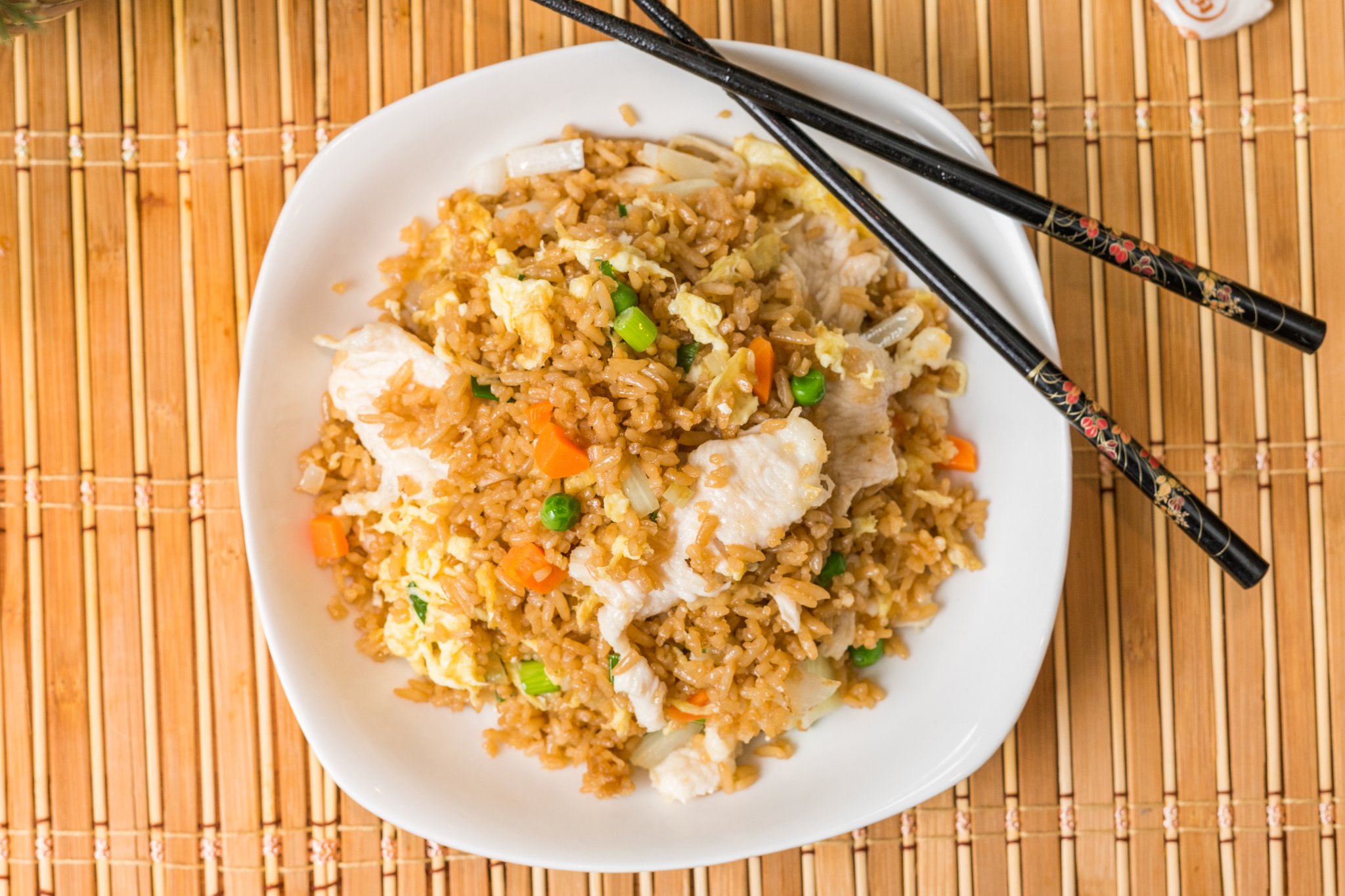 Chicken fried rice with egg and diced vegetables