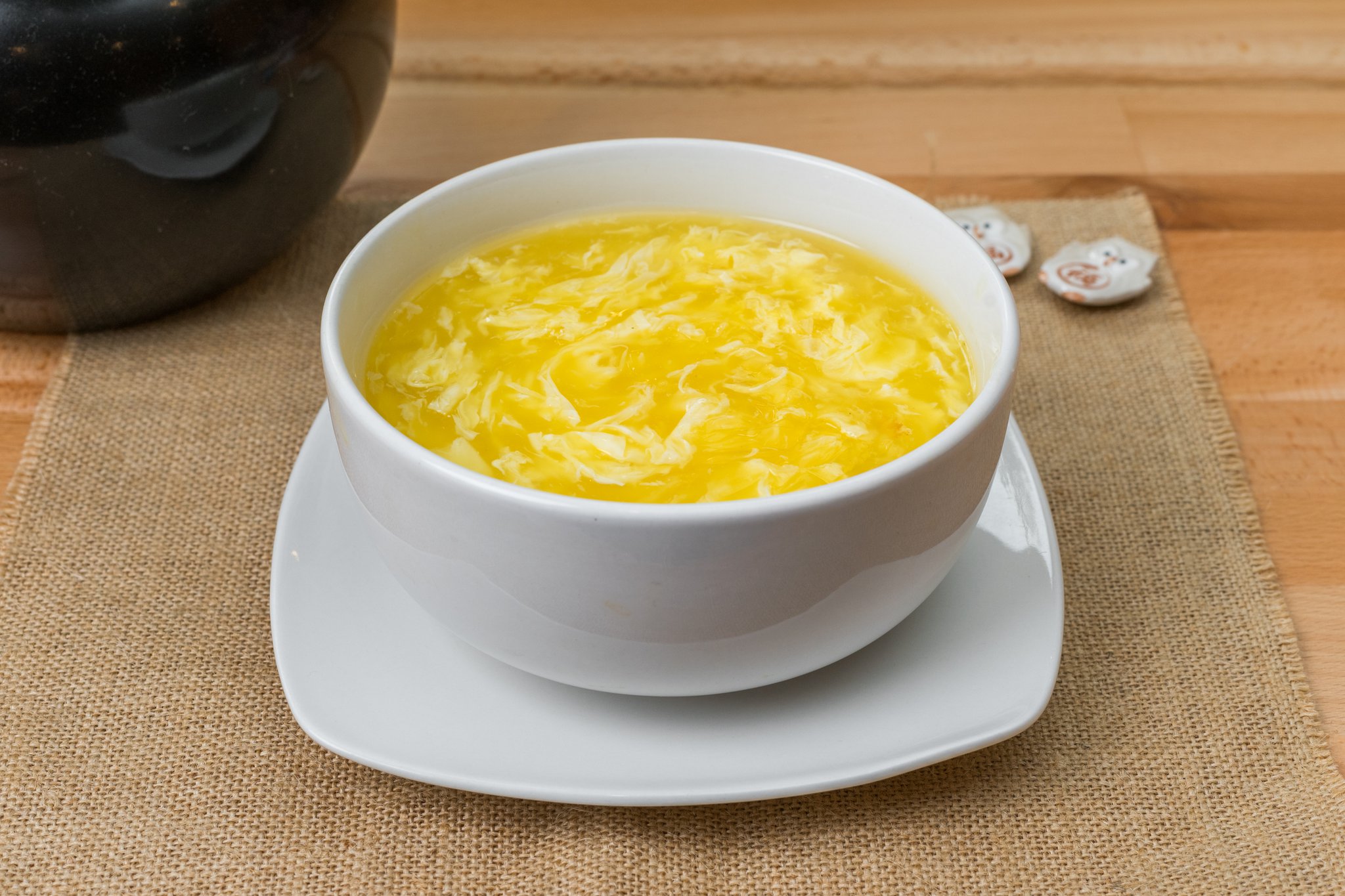 Egg drop soup with silky egg ribbons in warm broth