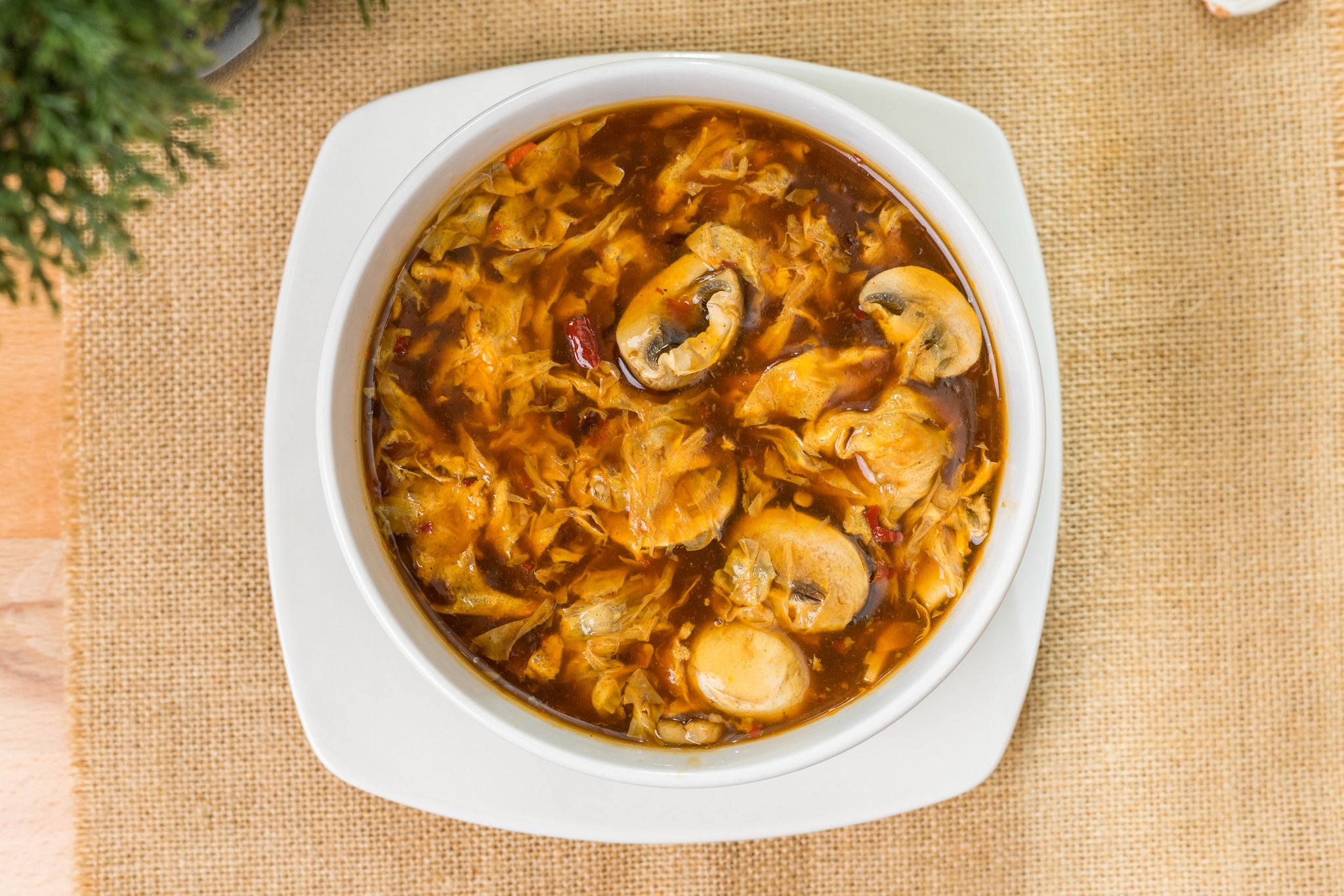 Hot and sour soup with mushrooms and egg ribbons