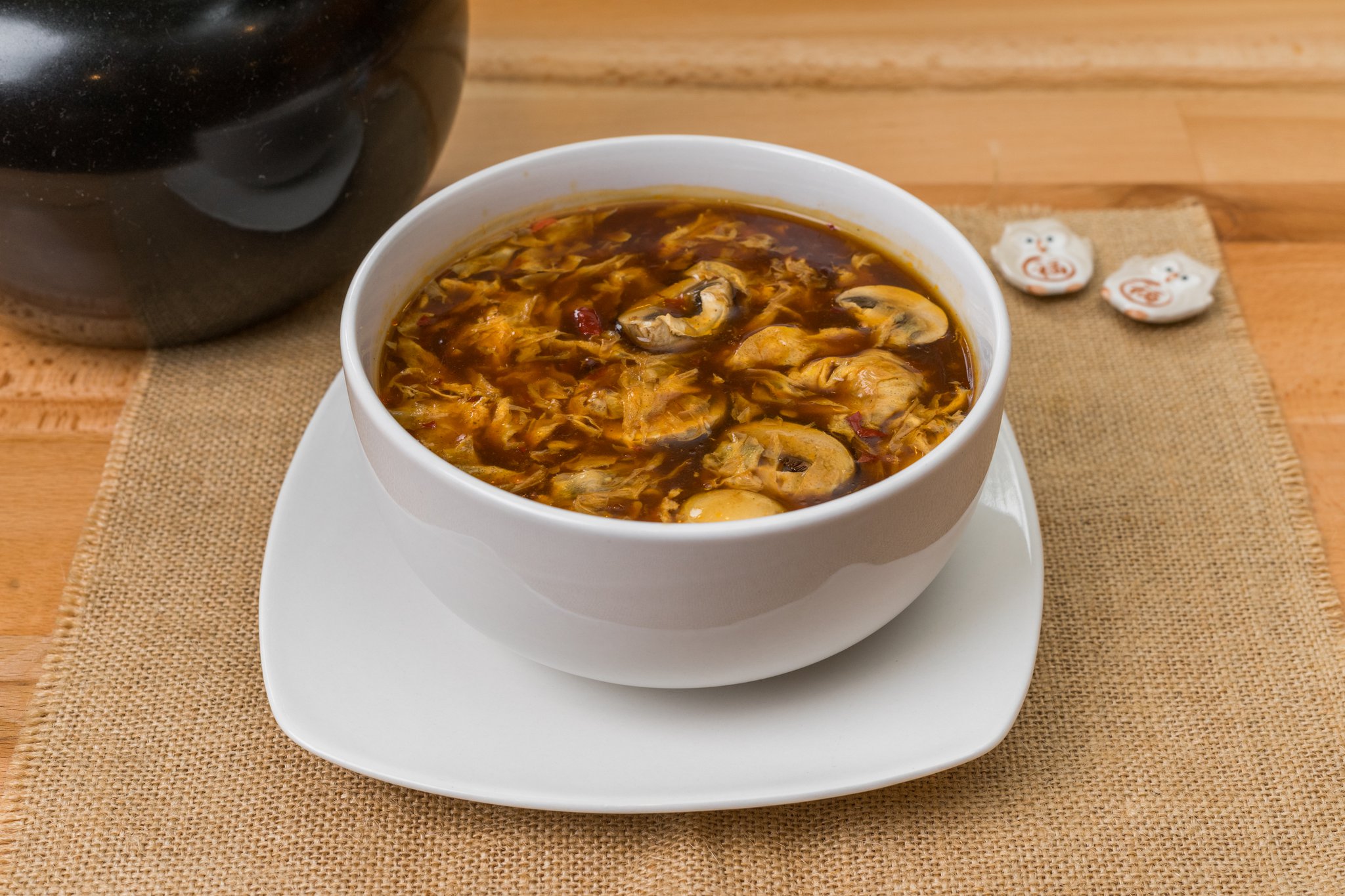 Hot and sour soup with mushrooms and egg strips