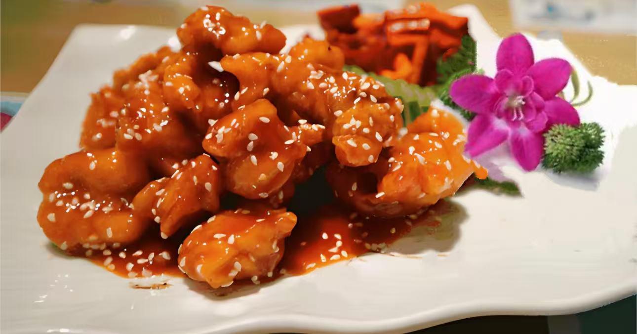 Asian-Grill-Asian-restaurant-Sweet-And-Sour-Chicken-Summerville Crispy chicken pieces in sweet and sour sauce with sesame seeds, served at Asian Grill, a Asian Restaurant in Summerville