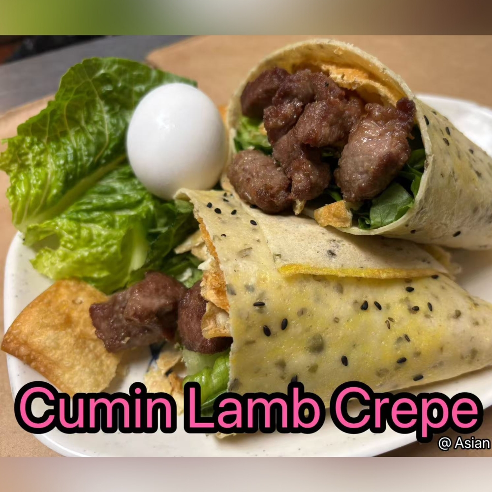 Crepe wrapped with cumin-infused lamb, fresh veggies, tasty and filling at Asian Kitchen, a Asian Restaurant in Rochester