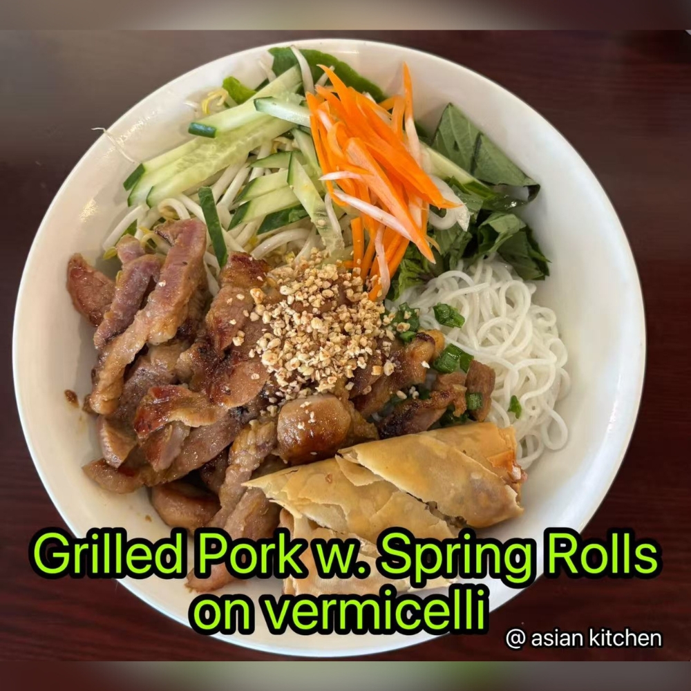 Vermicelli bowl with grilled pork, spring rolls, fresh veggies, nutty and delicious at Asian Kitchen, a Asian Restaurant in Rochester