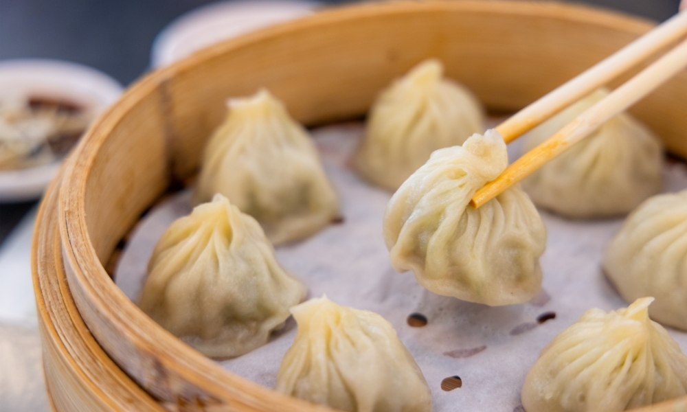 Soup dumplings in bamboo steamer at Asian Plate, a Chinese Restaurant in Arcadia