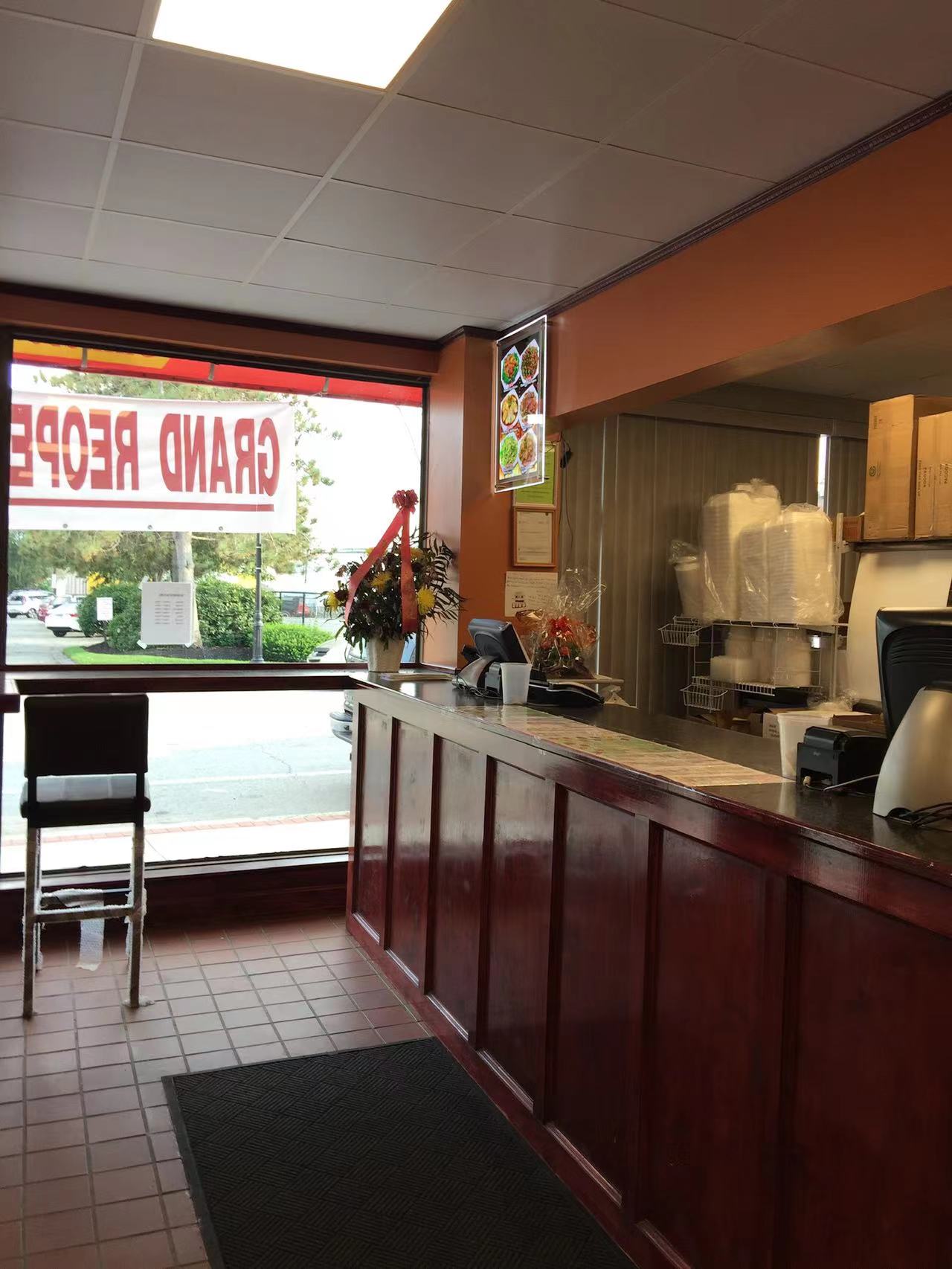 Counter area with seating and menu display at Asia Wok, a Chinese Restaurant in Waltham