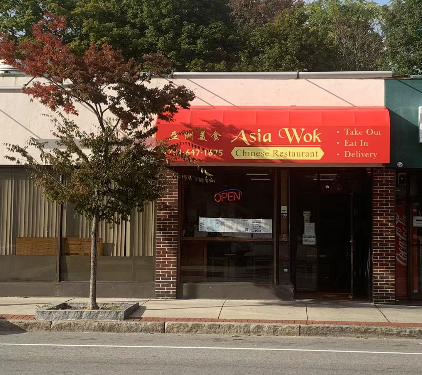 Exterior with red awning and "Asia Wok" signage at Asia Wok, a Chinese Restaurant in Waltham