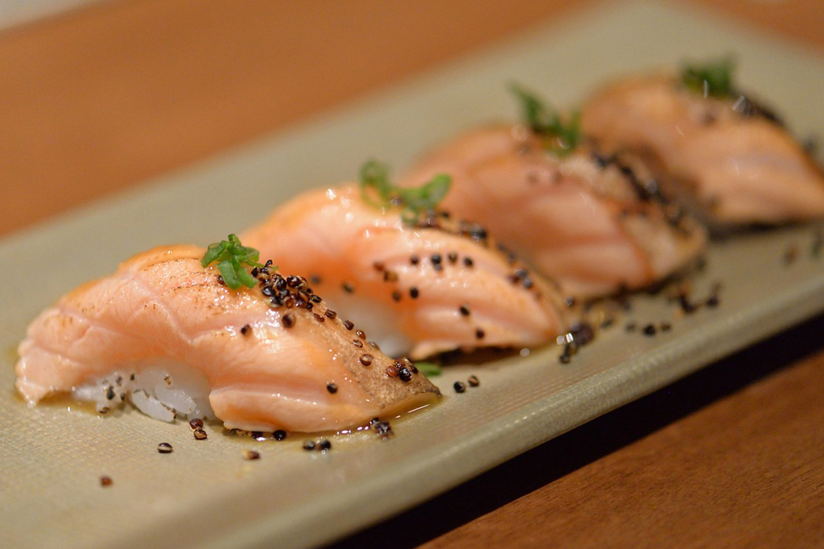 Seared salmon nigiri with quinoa and soy glaze at Asuka, an Asian Fusion Restaurant in Bloomington