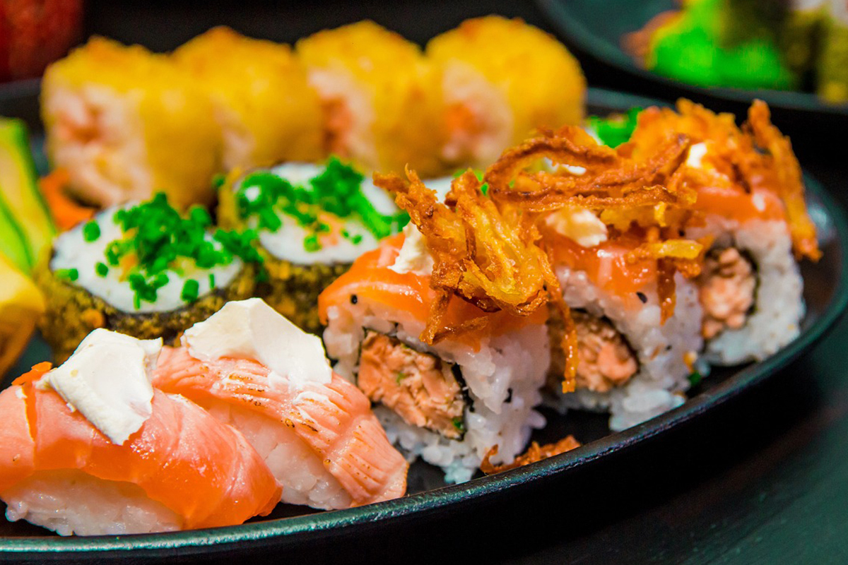 Assorted sushi rolls with crispy toppings and salmon at Asuka, an Asian Fusion Restaurant in Bloomington