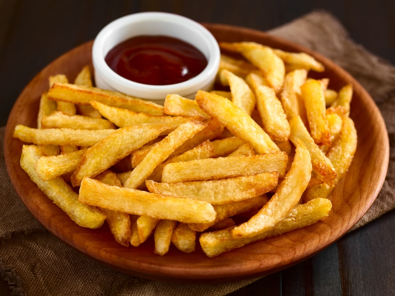 Golden thick-cut french fries with dipping sauce