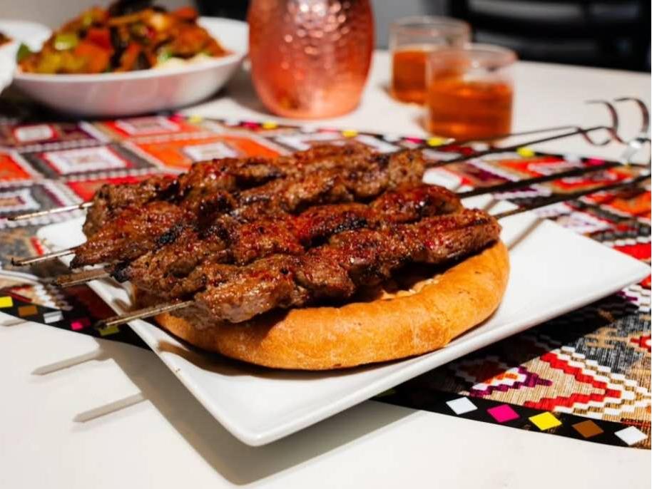 Lamb kebabs served on naan bread at Babahan Uyghur Cafe, a Chinese Xinjiang Flavors Restaurant in Plano