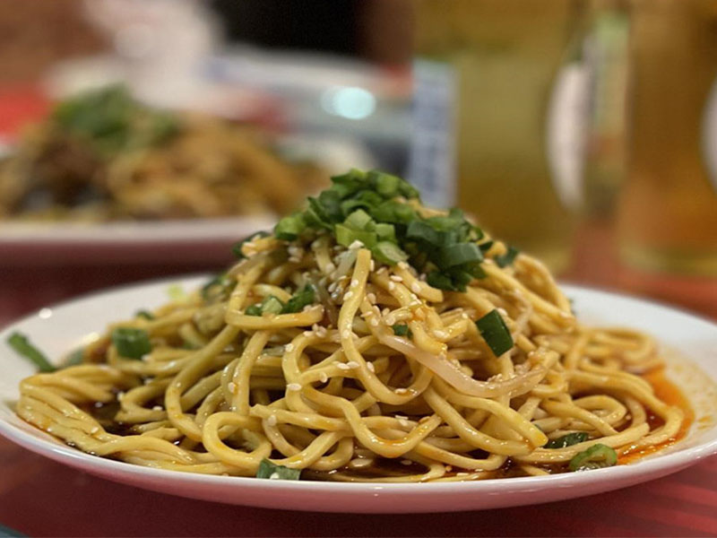 Chewy noodles tossed in sesame paste & scallions at Bamboo, a Chinese Restaurant in Norristown