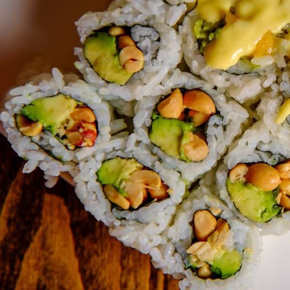 Peanut avocado sushi roll sliced and arranged on white plate at Bamboo Moon Chinese&Japanese Bubble Tea, an Asian Fusion Restaurant in Randolph