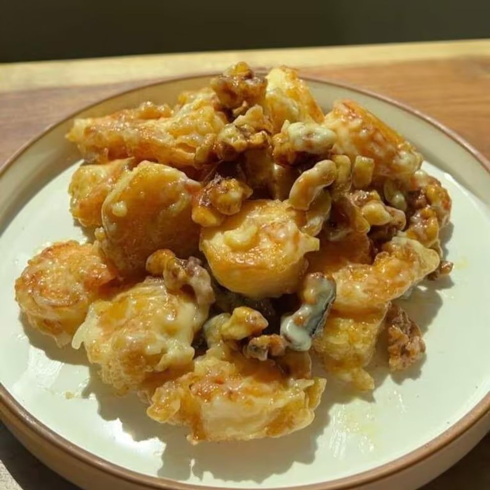 Walnut shrimp coated in creamy sweet sauce served on white plate at Bamboo Moon Chinese&Japanese Bubble Tea, an Asian Fusion Restaurant in Randolph