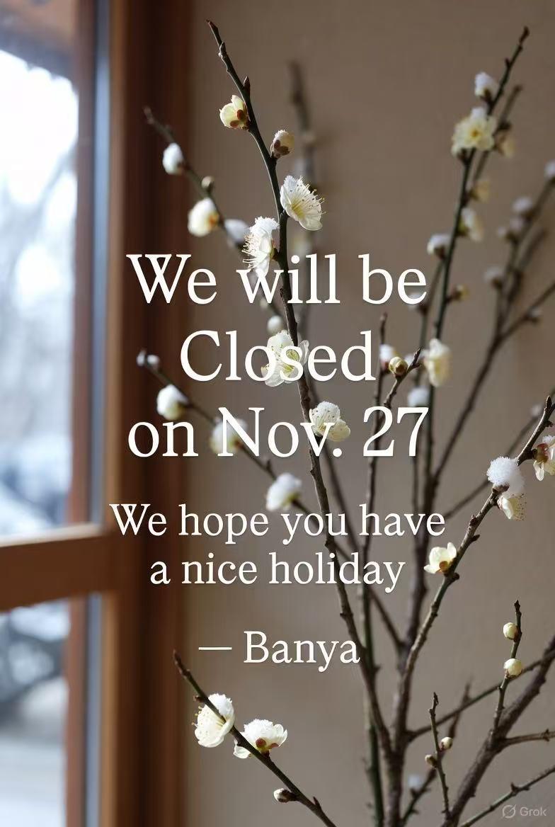 Branch with white blossoms by a window and text announcing closure on Nov. 27 and wishing a nice holiday.