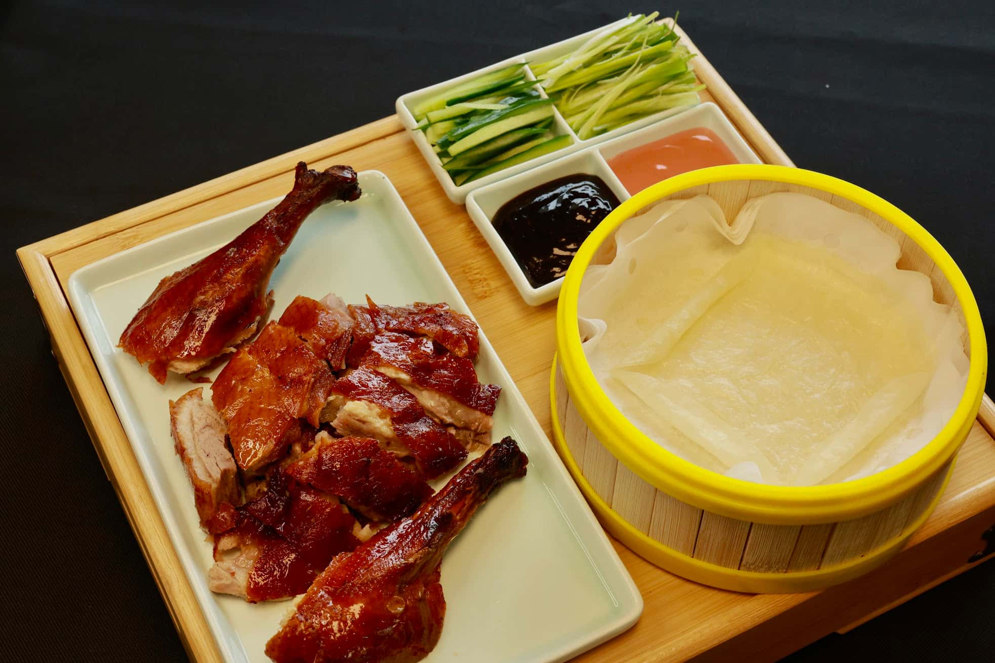 Roasted Peking duck served with pancakes and sauces at Bao House, a Chinese Restaurant in Stillwater