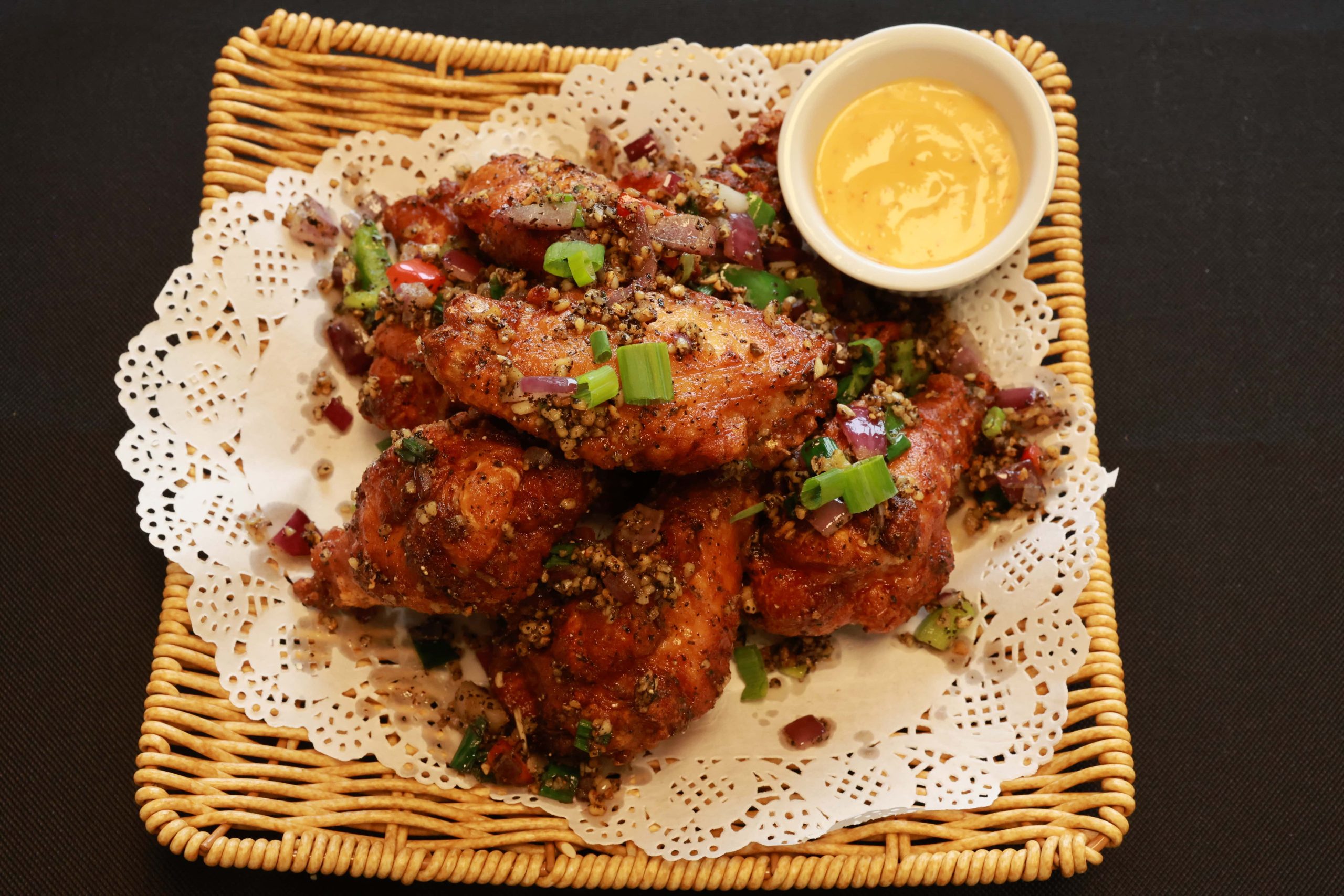 Crispy chicken wings tossed in salt and pepper with dipping sauce at Bao House, a Chinese Restaurant in Stillwater