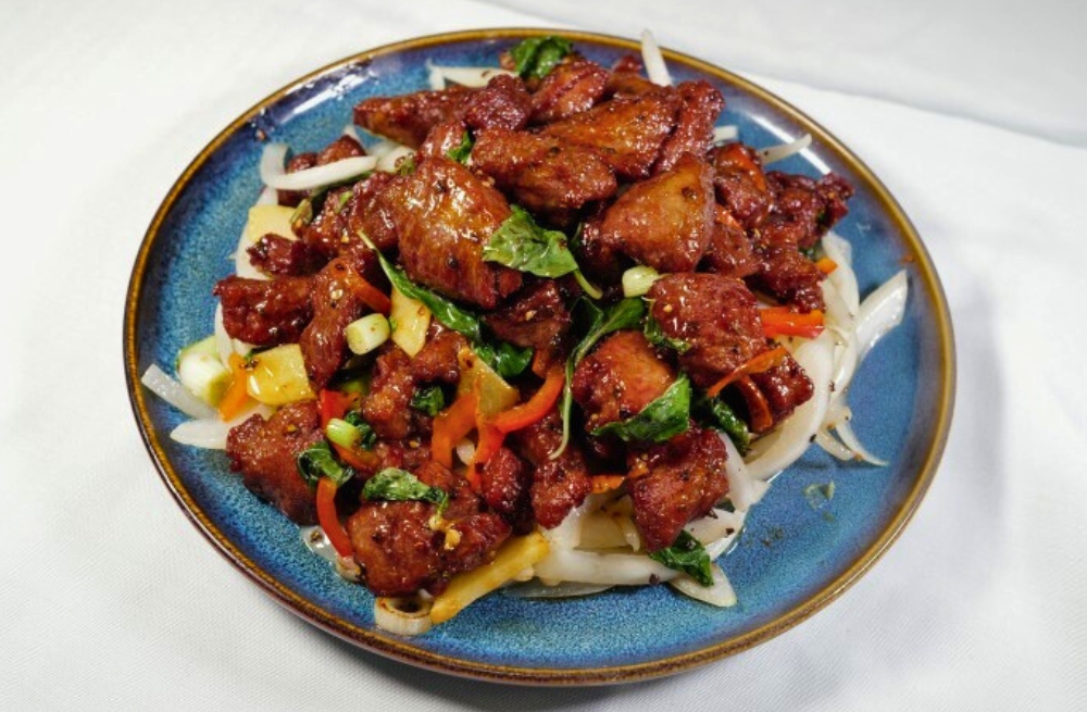 Juicy beef cubes stir-fried with basil and vegetables, served on noodles at Bao Kee Restaurant, a Chinese Restaurant in Hacienda Heights