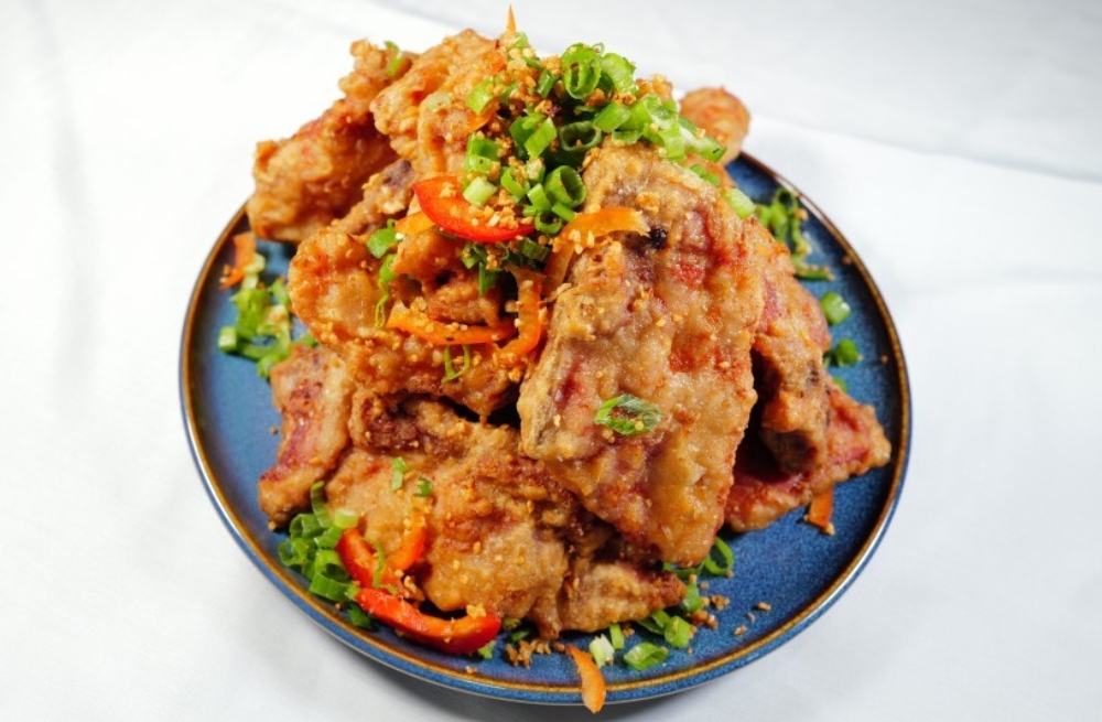 Crispy fried pork ribs garnished with green onions and chili, savory and crunchy at Bao Kee Restaurant, a Chinese Restaurant in Hacienda Heights
