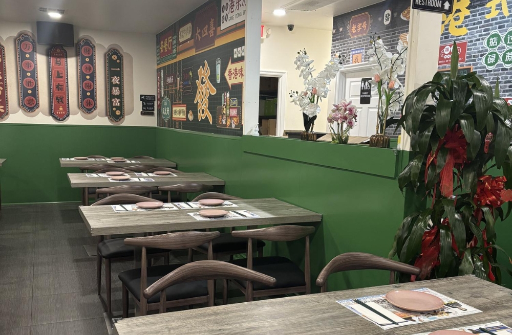 Neat dining area with green walls, themed murals, and arranged tables and chairs at Bao Kee Restaurant, a Chinese Restaurant in Hacienda Heights