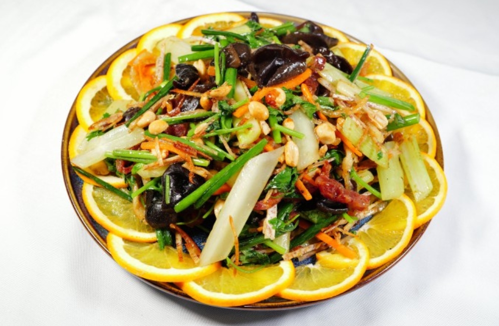 Colorful mixed salad with vegetables, nuts, and orange slices, fresh and crunchy at Bao Kee Restaurant, a Chinese Restaurant in Hacienda Heights