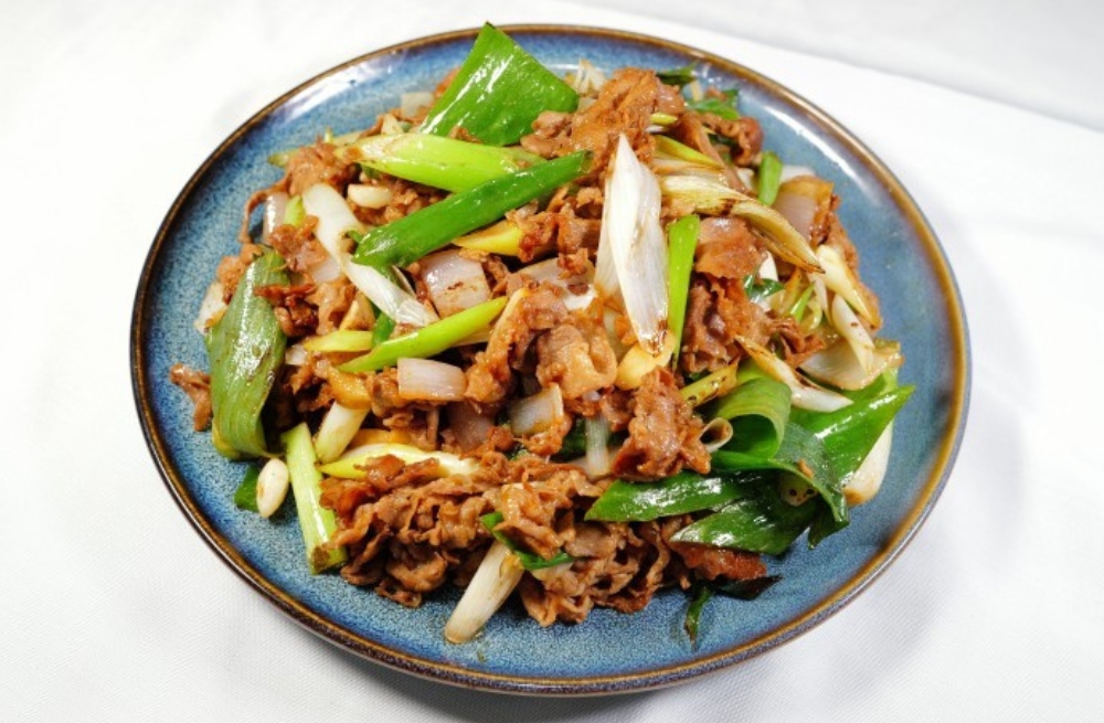 Tender beef stir-fried with green scallions and onions, savory and aromatic at Bao Kee Restaurant, a Chinese Restaurant in Hacienda Heights