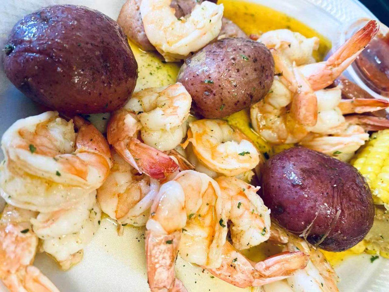 Garlic butter shrimp with red potatoes and corn at Bayou Fresh Seafood Grill & Sushi a Asian Fusion Restaurant in Jasper
