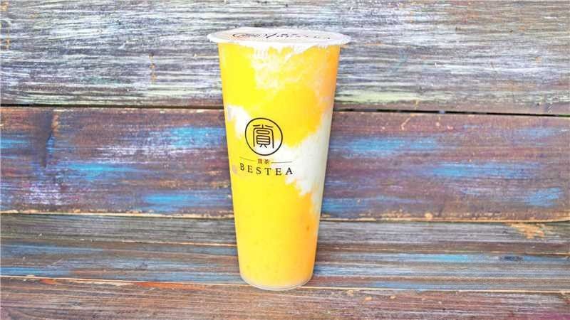 Mango Bubble Tea - Vibrant yellow tea with mango flavor and creamy swirls at Bestea & Sushi, a Japanese restaurant in Oviedo